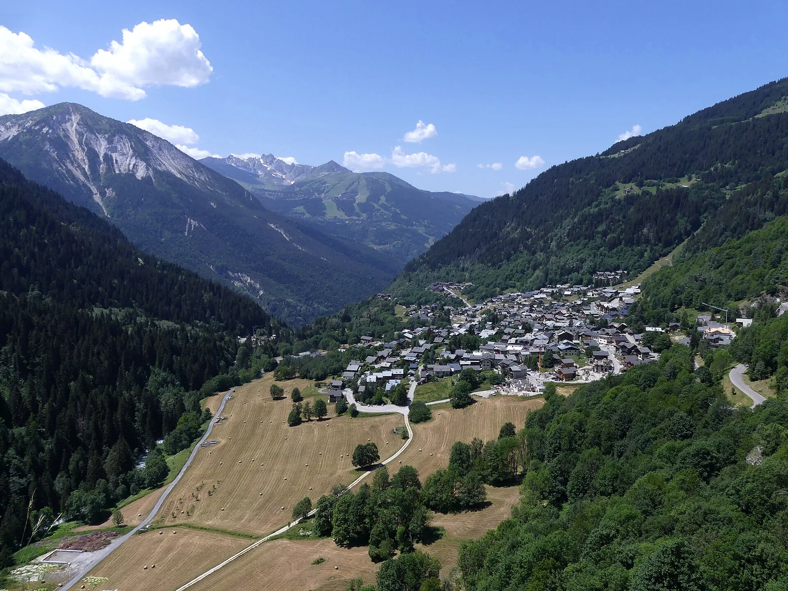 Eastern surroundings of Champagny-en-Vanoise with meadows and alpine ridges in summer