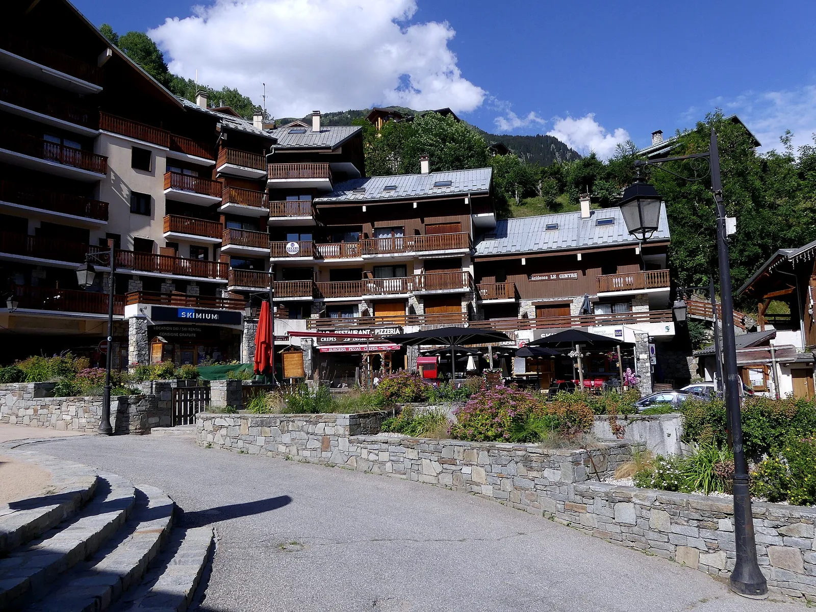 Place du Centre square in Champagny-en-Vanoise village on a summer day