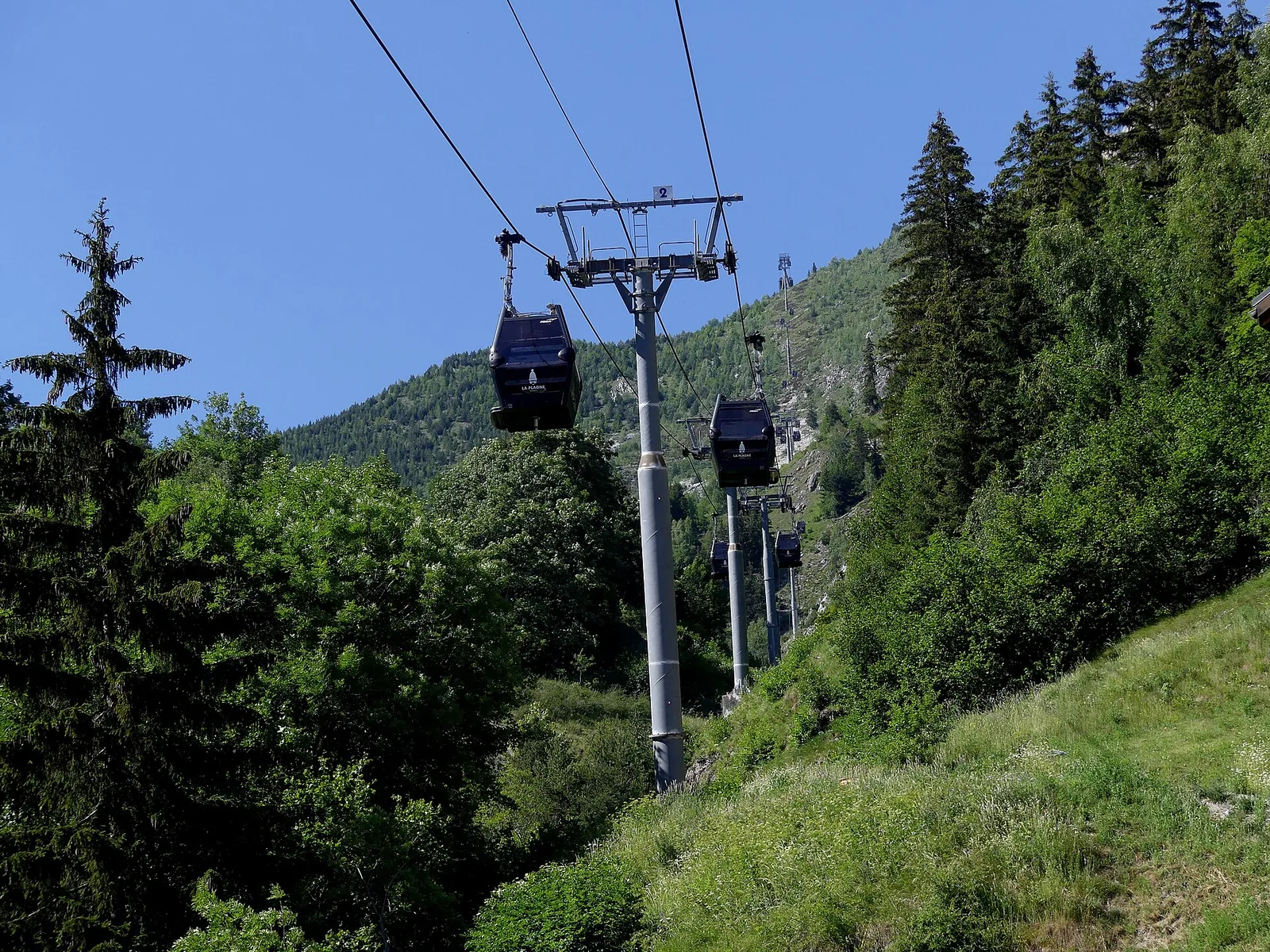 Champagny gondola (télécabine) station and cables in early summer